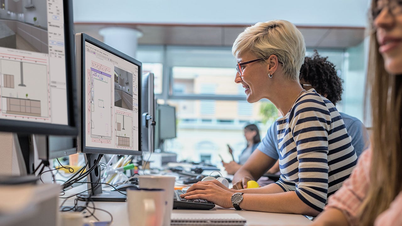 A woman focused on her computer.