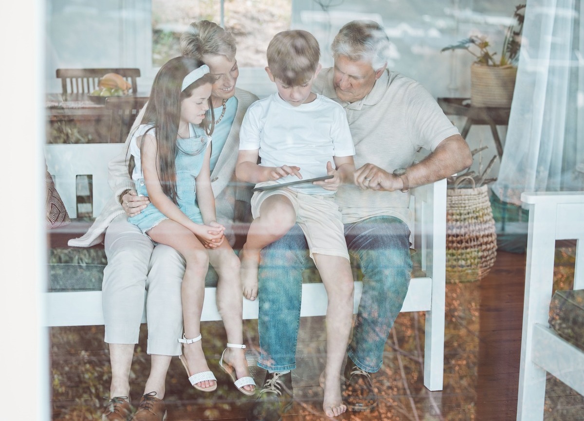 Family with a tablet device