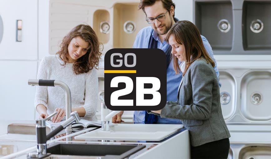 Modern kitchen with sleek design and appliances featuring Go2B logo.