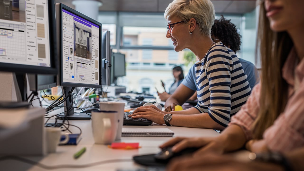 A woman focused on her computer