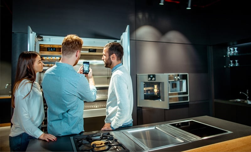 A couple choosing a refrigerator