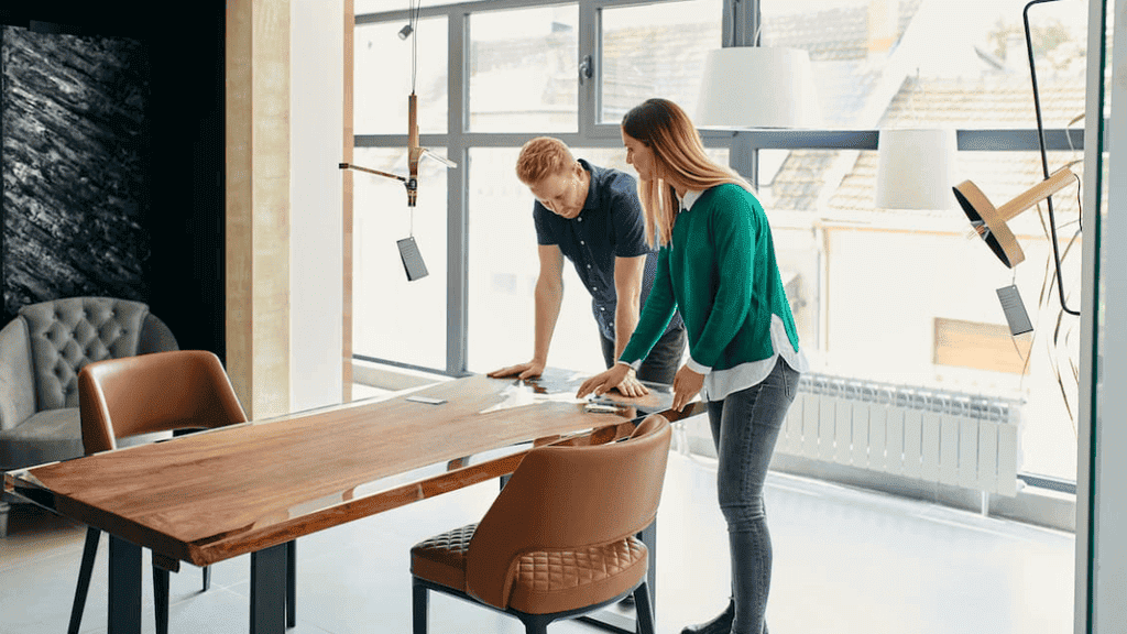 Two individuals collaborate on a project