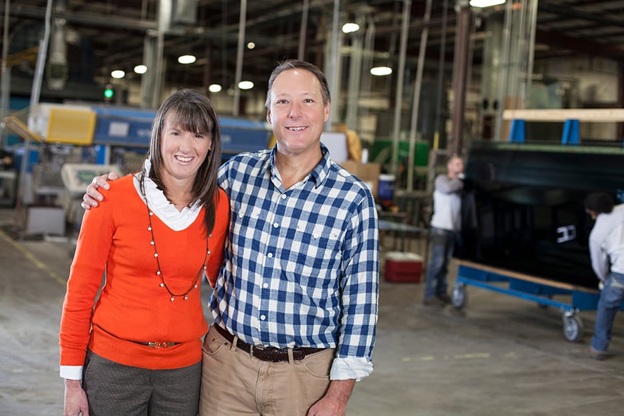 TriStar Glass leadership posing inside the manufacturing facility, highlighting their partnership with FeneVision.